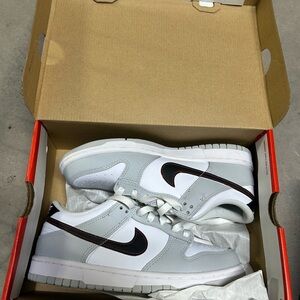 Nike White and Light Gray Sneakers with Black Swoosh